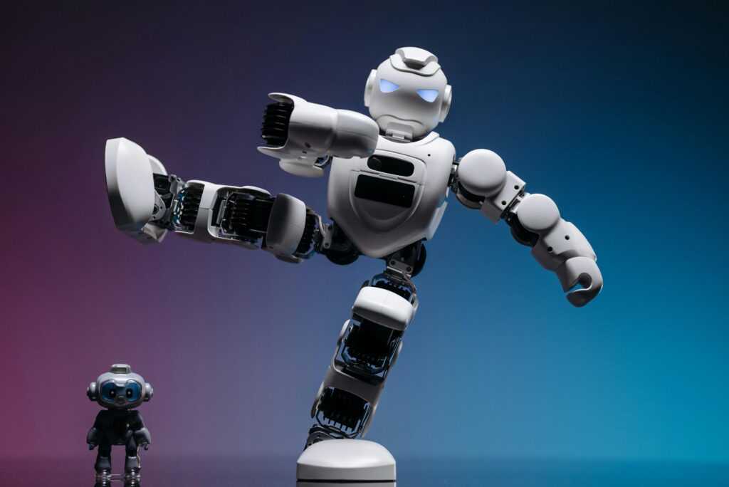 Close-up of two futuristic robots in a studio setting, showcasing advanced robotics and innovation.